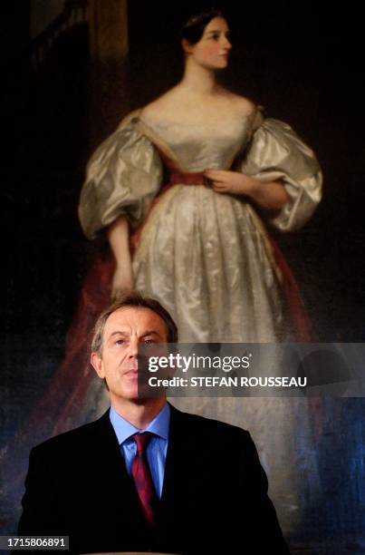 British Prime Minister Tony Blair stands in front of Augusta Ada Byron, Countess of Lovelace, by Margaret Carpenter, during a press conference at...