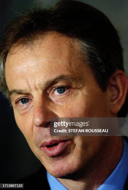 British Prime Minister Tony Blair stands in front of Augusta Ada Byron, Countess of Lovelace, by Margaret Carpenter, during a press conference at...