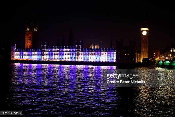 The Houses of Parliament are lit up blue and white in support of Israel on October 9, 2023 in London, England. The Palestinian militant group Hamas...