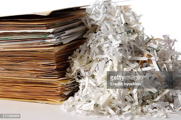isolated shot of shredded documents with folder on white background - destruction stock pictures, royalty-free photos & images