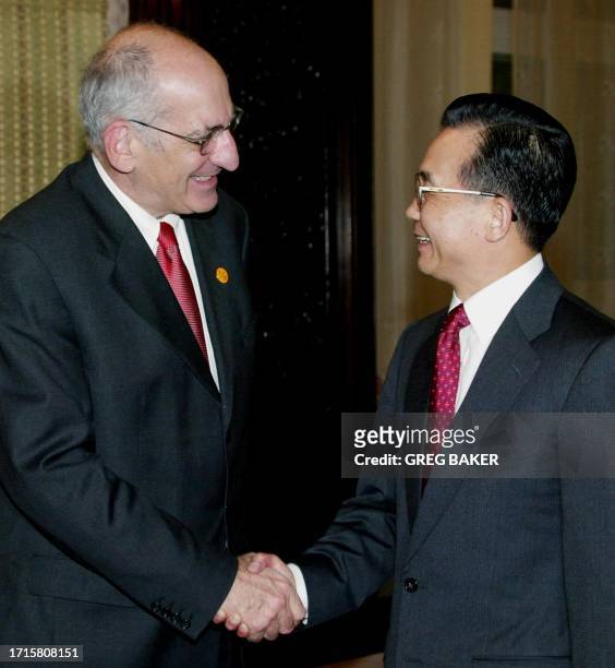 Swiss President Pascal Couchepin is greeted by Chinese Premier Wen Jiabao before a meeting at the Zhongnanhai leadership compound in Beijing, 21...