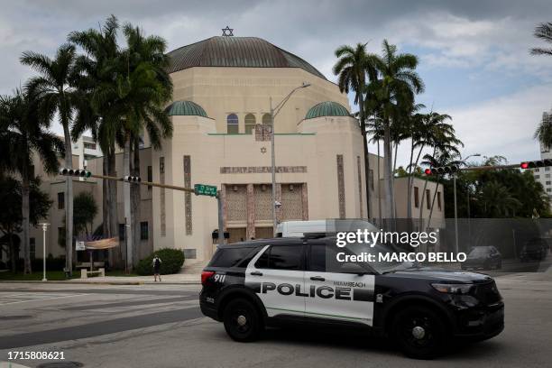 Miami Beach police patrol drives past Temple Emanu-El synagogue in Miami Beach, Florida, on October 9 after the Palestinian militant group Hamas...