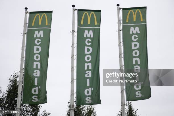 Flags with McDonald's logo are seen near the restaurant in Chelm, Poland on October 9, 2023.