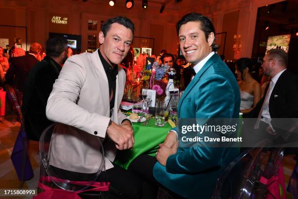 Luke Evans and Vernon Kay attend the Art Of Wishes Gala 2023 at The OWO Raffles Hotel on October 9, 2023 in London, England.