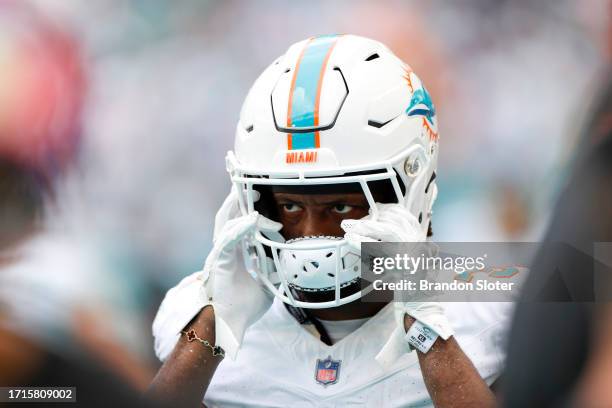 Eli Apple of the Miami Dolphins adjusts his helmet in the first half against the New York Giants at Hard Rock Stadium on October 8, 2023 in Miami...