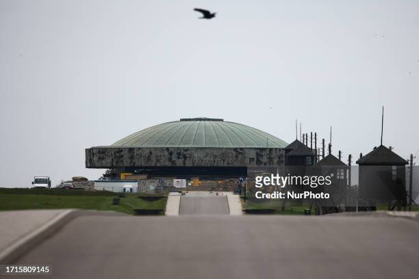 View of the Mausoleum and watchtowers at the former Majdanek concentration camp in Lublin, Poland on October 9, 2023.
