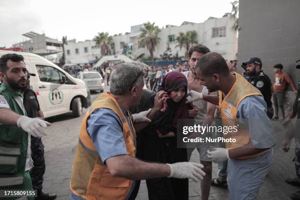 Many wounded women and children arrive at Al-Shifa Hospital in the Gaza Strip on October 9, 2023.