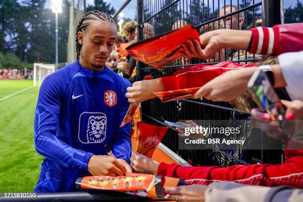 Xavi Simons of the Netherlands giving a signature to a fan during a Training Session of the Netherlands Mens Football Team at the KNVB Campus on...