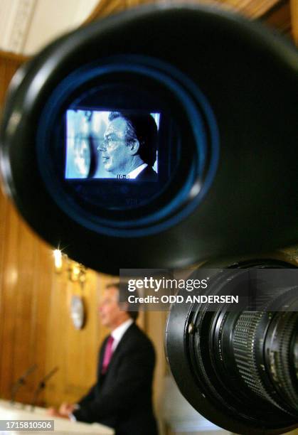 Britain's Prime minister Tony Blair is seen in the view finder of a television camera as he addresses the media during his monthly press conference...