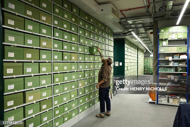 Fungarium Collections manager Lee Davies inspects a fungus sample stored within the Fungarium at the Royal Botanic Gardens in Kew, west London, on...