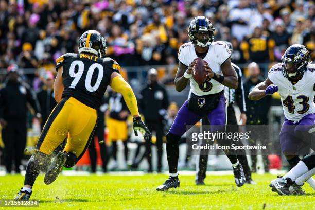 Pittsburgh Steelers linebacker T.J. Watt rushes Baltimore Ravens quarterback Lamar Jackson during the regular season NFL football game between the...
