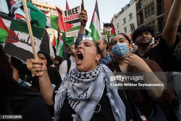 Palestinians and their supporters gather outside the Embassy of Israel in London to demonstrate solidarity with the Palestinian people and demand an...