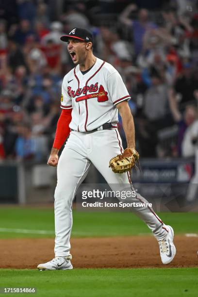 Atlanta Braves first baseman Matt Olson reacts as Philadelphia Phillies first baseman Bryce Harper is doubled up at first base to end game 2 of the...