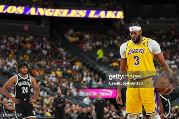 Anthony Davis of the Los Angeles Lakers shoots a free throw during the game against the Brooklyn Nets on October 9, 2023 at T-Mobile Arena in Las...