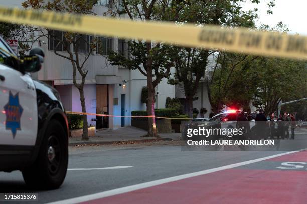 Police officers are seen outside the visa office of the Chinese consulate, where earlier a vehicle crashed into the building, in San Francisco,...