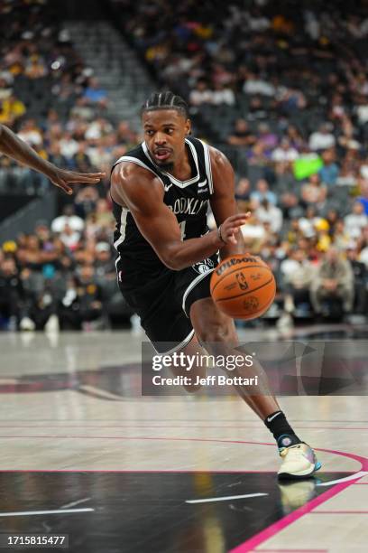 Dennis Smith Jr. #4 of the Brooklyn Nets drives to the basket during the game against the Los Angeles Lakers on October 9, 2023 at T-Mobile Arena in...