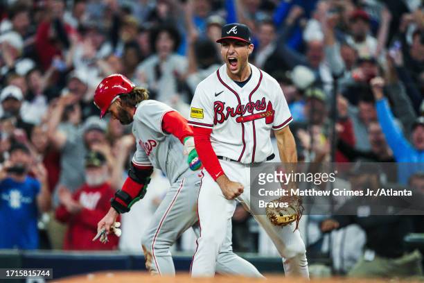 Matt Olson of the Atlanta Braves reacts after doubling up Bryce Harper of the Philadelphia Phillies to end Game Two of the Division Series at Truist...