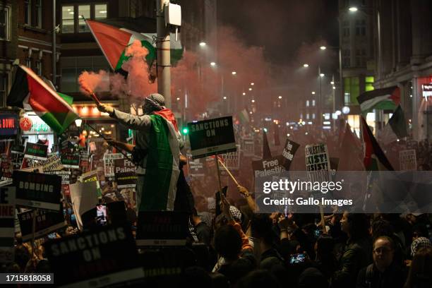 Thousands of pro-Palestine demonstrators protest outside the Israeli Embassy on October 09, 2023 in London, United Kingdom. The group is standing in...