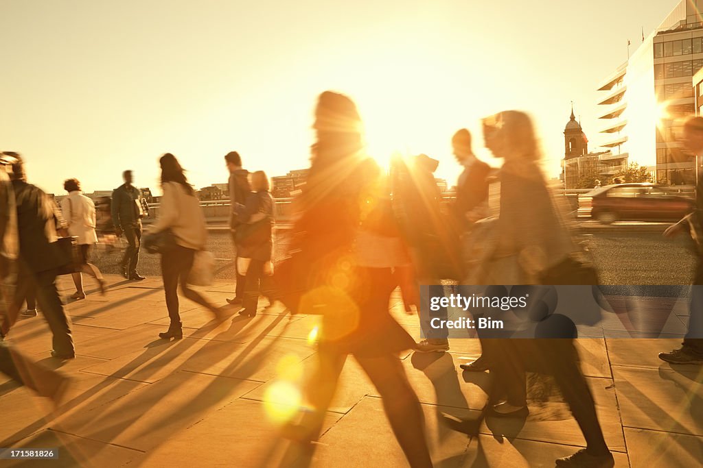 Business Commuters Walking Home After Work, Sunset Backlit, Blurred Motion