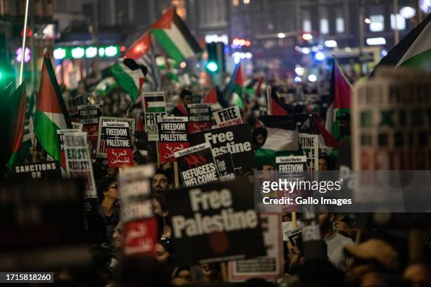 Thousands of pro-Palestine demonstrators protest outside the Israeli Embassy on October 09, 2023 in London, United Kingdom. The group is standing in...