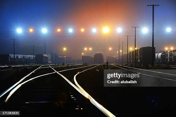 rail terminal - train yard at night stock pictures, royalty-free photos & images
