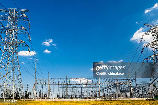 power pylons and substation - electrical grid stock pictures, royalty-free photos & images