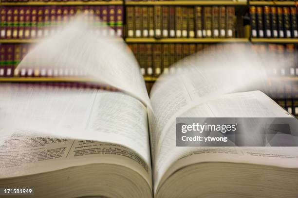 flipping pages - law library stock pictures, royalty-free photos & images
