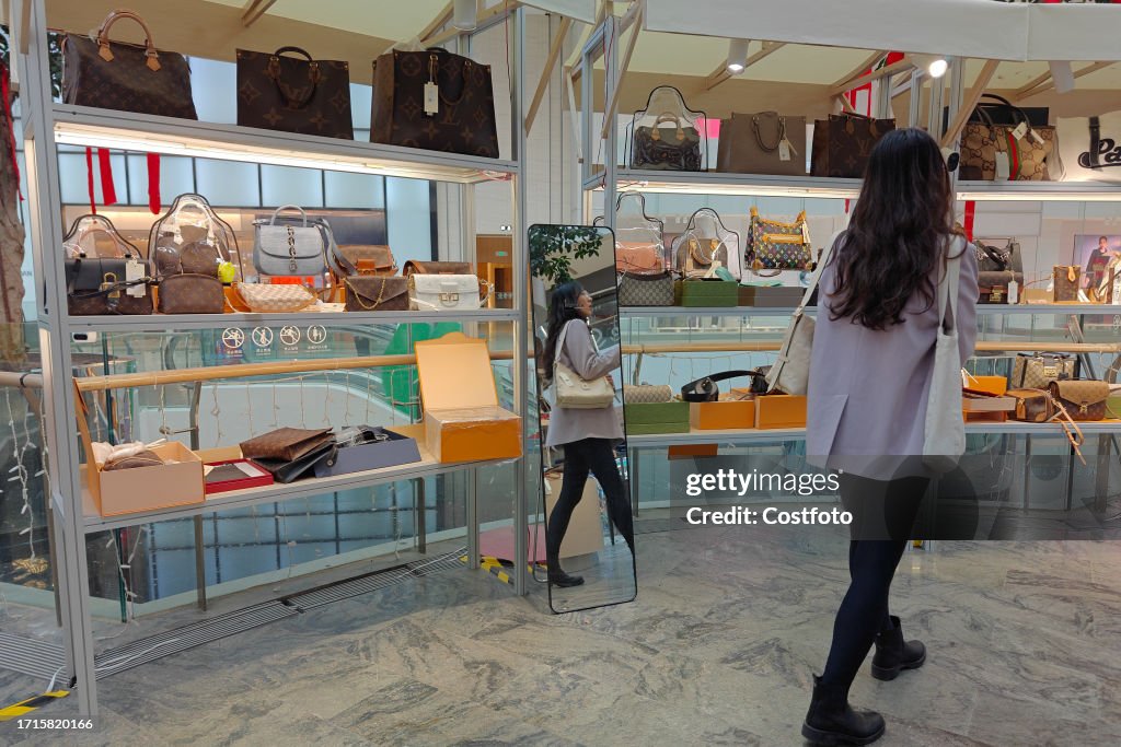 SHANGHAI, CHINA - OCTOBER 10, 2023 - Young customers buy second
