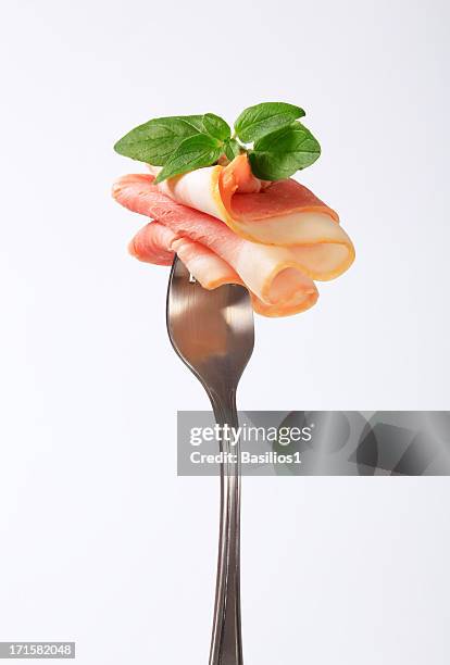 ham with basil on a fork - ham salami bildbanksfoton och bilder
