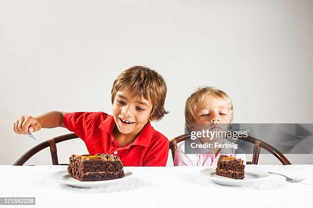 big piece of cake and a little one, inequality concept. - taartpunt stockfoto's en -beelden