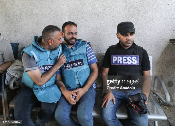 Relatives and colleagues of Palestinian journalists Saeed Al-Taweel and Mohammad Sobh, who were killed in Israeli airstrikes, mourn in Gaza Strip on...