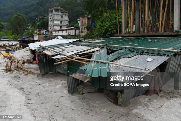 General view of shanties buried by flash floods after a lake burst. A glacial lake in northeast India burst through a dam shortly after midnight,...
