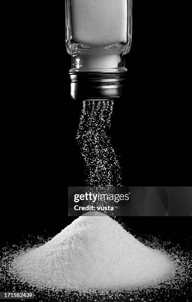 pouring salt - salt and pepper shaker stock pictures, royalty-free photos & images