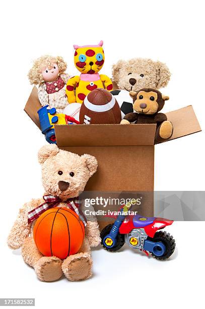 box full of toys, donations - donation box white background stock pictures, royalty-free photos & images