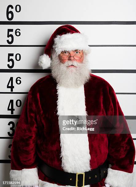 santa claus mugshot - rich fury stock pictures, royalty-free photos & images