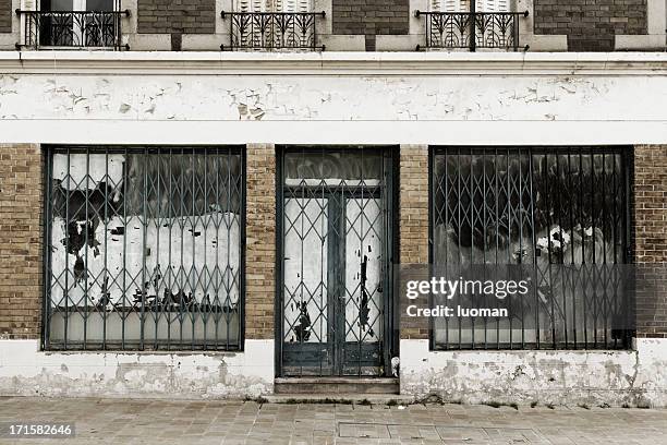 abandoned and destroyed shop - security screen stock pictures, royalty-free photos & images