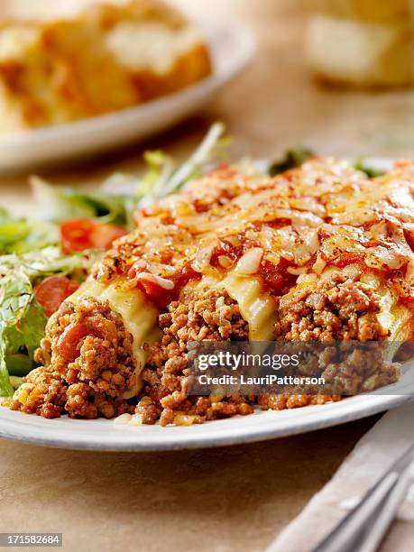 stuffed manicotti - cannelloni stock pictures, royalty-free photos & images