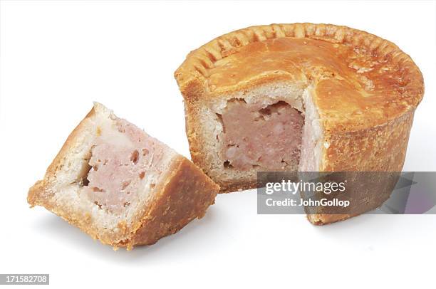 individual pork pie against white background - pork pie isolated stock pictures, royalty-free photos & images