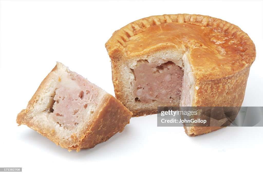 Individual pork pie against white background