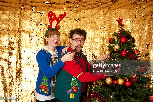 ugly christmas sweater couple - nerd sweater stock pictures, royalty-free photos & images