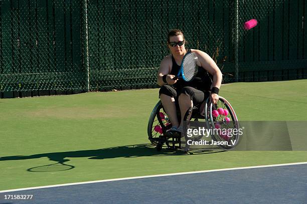 athlete playing wheelchair tennis - wheelchair tennis stock pictures, royalty-free photos & images
