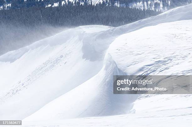 windswept snow cornice on mountain ridge - snow cornice stock pictures, royalty-free photos & images
