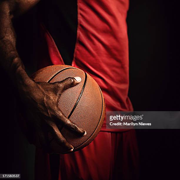 gripping the basketball - athletics texture stock pictures, royalty-free photos & images