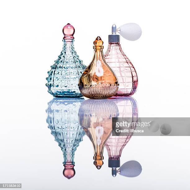 perfume bottles studio shot on white with reflection - perfume atomizer stock pictures, royalty-free photos & images