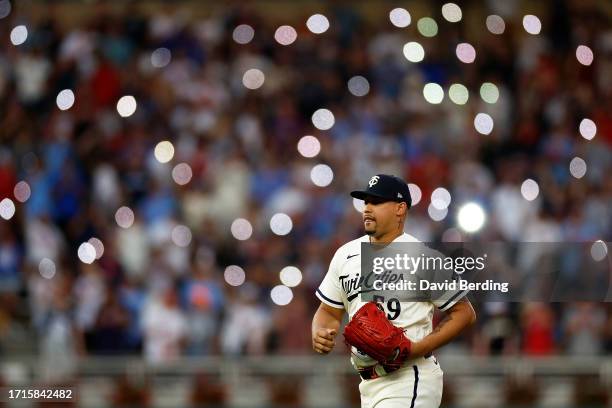 Jhoan Duran of the Minnesota Twins runs to the pitcher's mound against the Toronto Blue Jays during the ninth inning in Game One of the Wild Card...