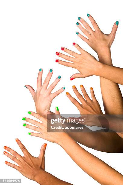 group of raised multiethnics female hands with colored manicure - multi coloured nails stock pictures, royalty-free photos & images