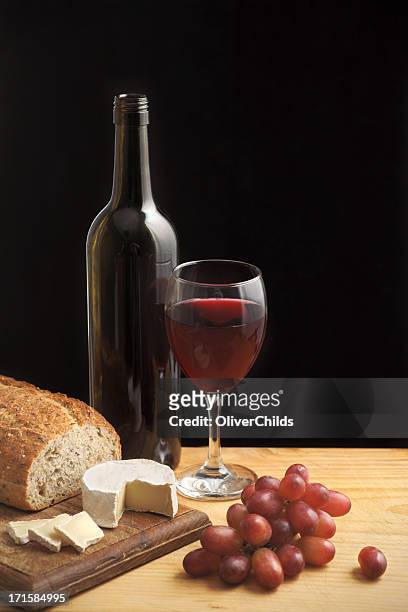 still life with wine cheese and grapes. - wine still life stock pictures, royalty-free photos & images