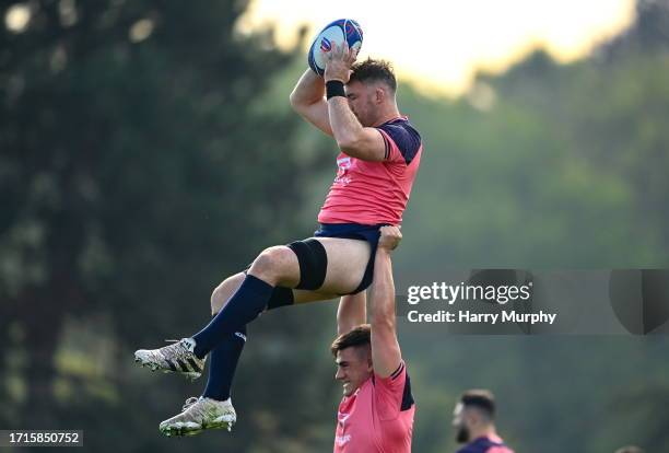 Paris , France - 10 October 2023; Peter O'Mahony is lifted by Dan Sheehan during an Ireland rugby squad training session at Stade Omnisports des...