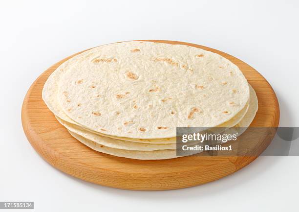 mexican tortillas on a cutting board - round wooden chopping board stock pictures, royalty-free photos & images