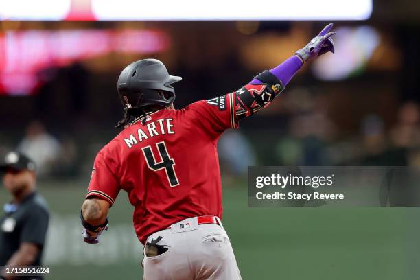 Ketel Marte of the Arizona Diamondbacks rounds the bases after hitting a home run in the third inning against the Milwaukee Brewers during Game One...